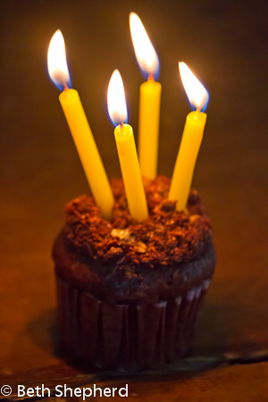 Four candles in a cupcake