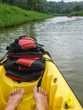 kayak and blue toenails at Hanalei River
